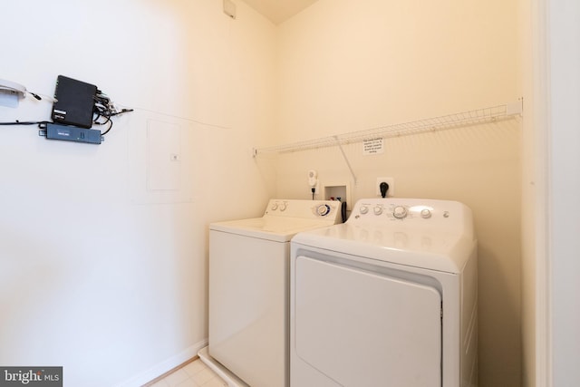 laundry area featuring washing machine and clothes dryer