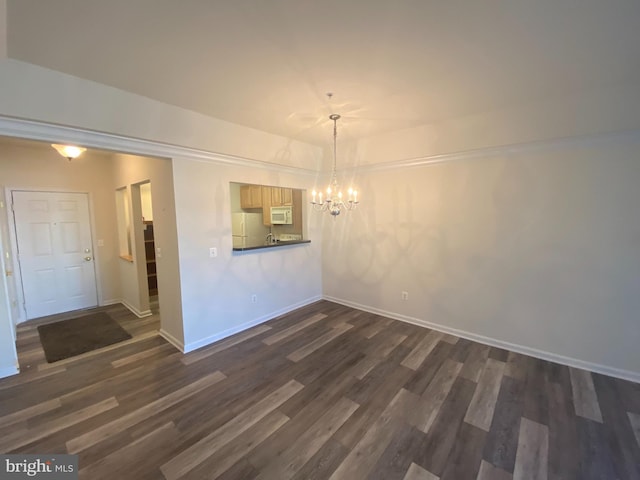 unfurnished dining area featuring a notable chandelier and dark hardwood / wood-style floors