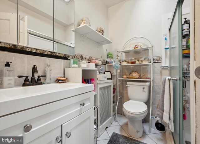 1337 S 54th St, Philadelphia, PA 19143 - bathroom with vanity, tile patterned floors, toilet, wainscoting, and tile walls