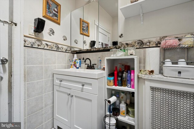 1337 S 54th St, Philadelphia, PA 19143 - bathroom with vanity and tile walls