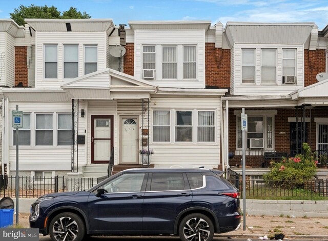 1337 S 54th St, Philadelphia, PA 19143 - view of property with brick siding and a fenced front yard
