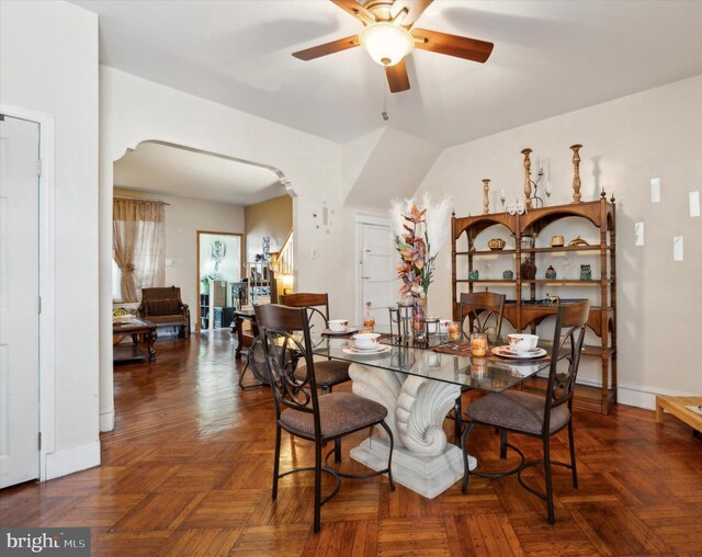 1337 S 54th St, Philadelphia, PA 19143 - dining room featuring arched walkways, baseboards, and ceiling fan