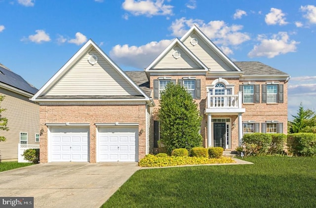 view of front of property featuring a front yard, a garage, and a balcony