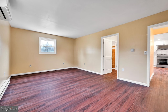 unfurnished room featuring dark hardwood / wood-style floors, a wall mounted AC, and a baseboard heating unit