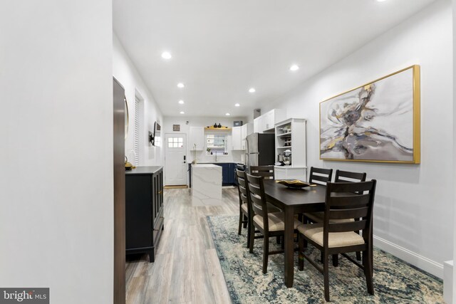 dining area with light hardwood / wood-style flooring