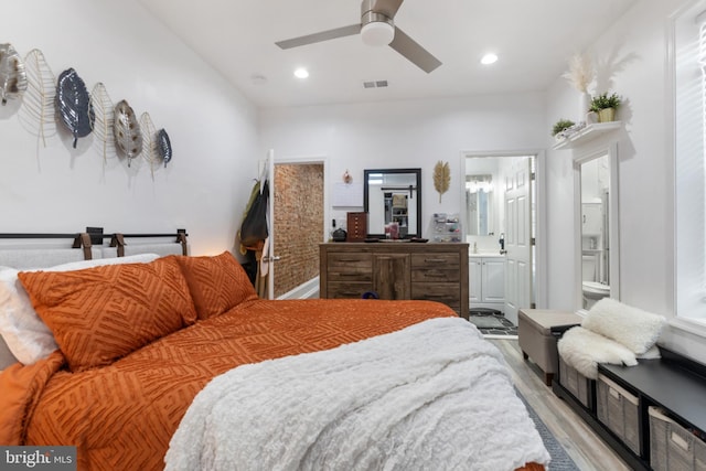 bedroom featuring ensuite bathroom, ceiling fan, and light hardwood / wood-style floors