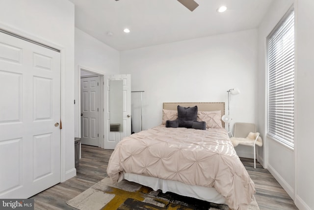 bedroom featuring hardwood / wood-style floors and ceiling fan