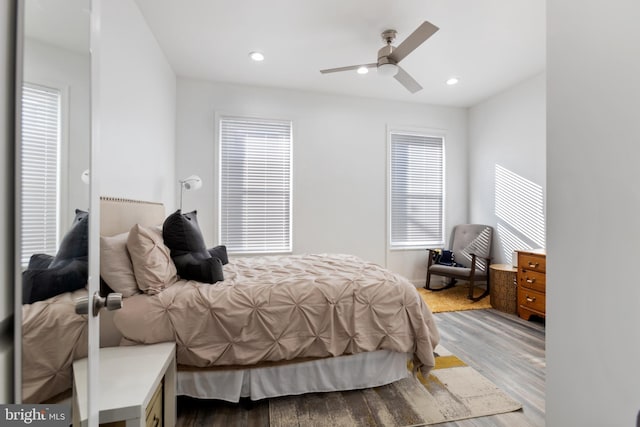 bedroom featuring hardwood / wood-style flooring and ceiling fan