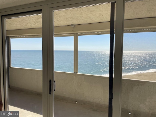 property view of water featuring a beach view