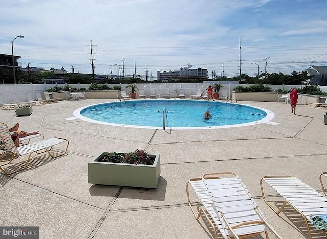 view of pool featuring a patio area