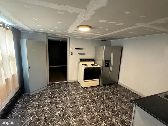 kitchen featuring white cabinets, white electric range oven, and stainless steel fridge