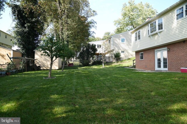 view of yard featuring french doors