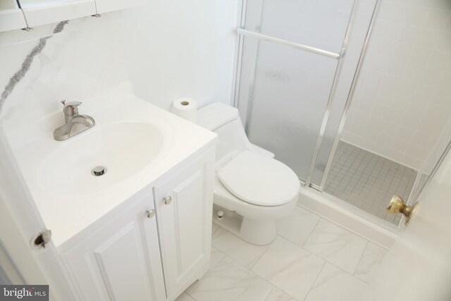 bathroom with vanity, walk in shower, and toilet