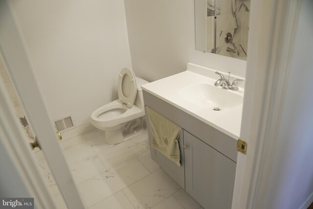 bathroom with vanity and toilet