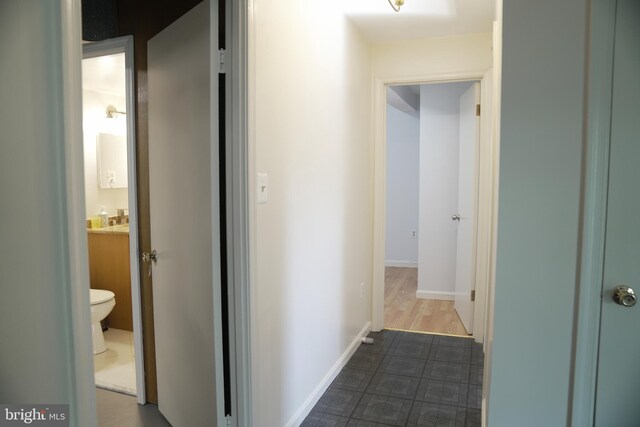 corridor featuring dark hardwood / wood-style flooring