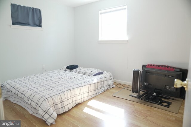 bedroom with hardwood / wood-style flooring