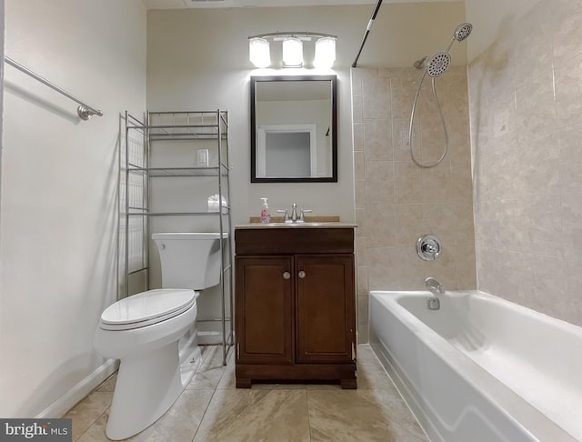 full bathroom with tiled shower / bath, vanity, toilet, and tile patterned floors