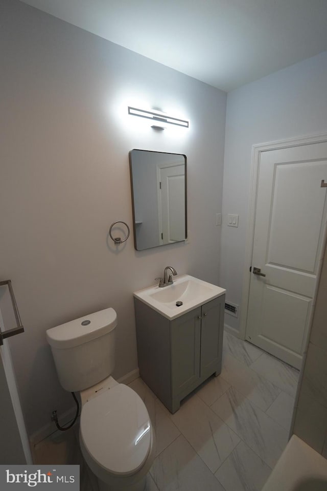 bathroom with vanity and toilet