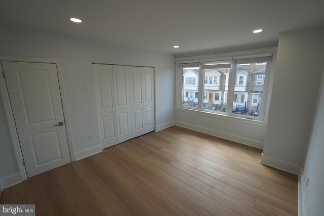 unfurnished bedroom featuring light hardwood / wood-style floors