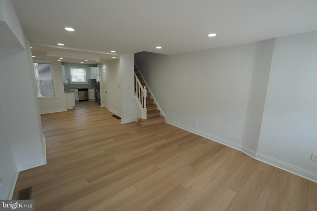 unfurnished living room with light wood-type flooring