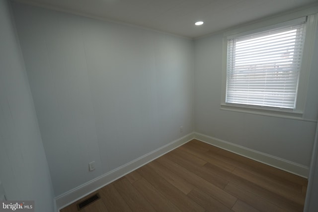 spare room with hardwood / wood-style flooring