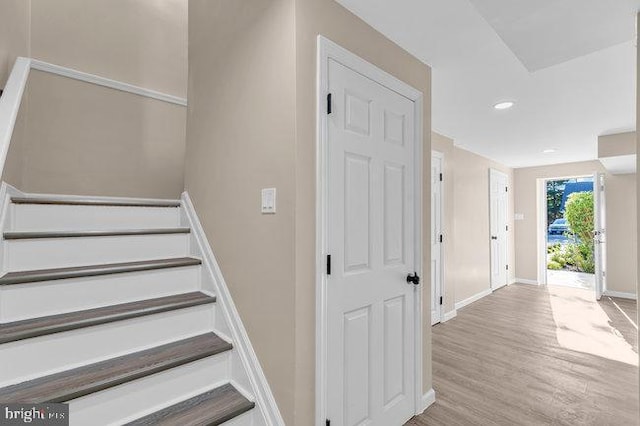 staircase featuring hardwood / wood-style floors