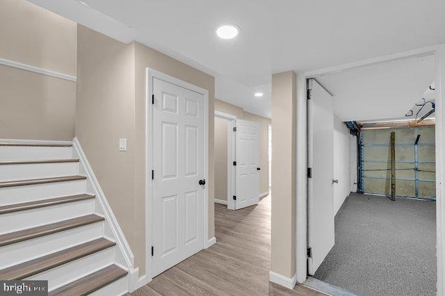 stairway featuring hardwood / wood-style flooring