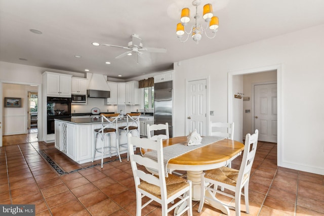 dining room with ceiling fan with notable chandelier and tile patterned flooring