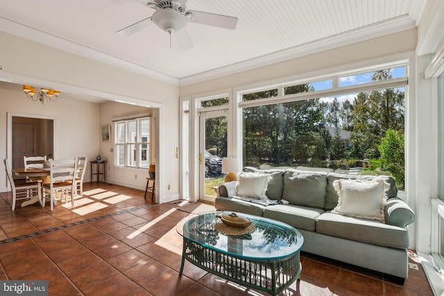 sunroom / solarium featuring ceiling fan