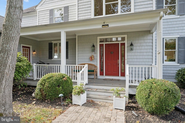 doorway to property with a porch