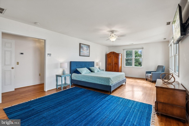 bedroom featuring ceiling fan and hardwood / wood-style floors