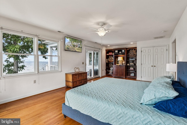 bedroom featuring hardwood / wood-style flooring and ceiling fan