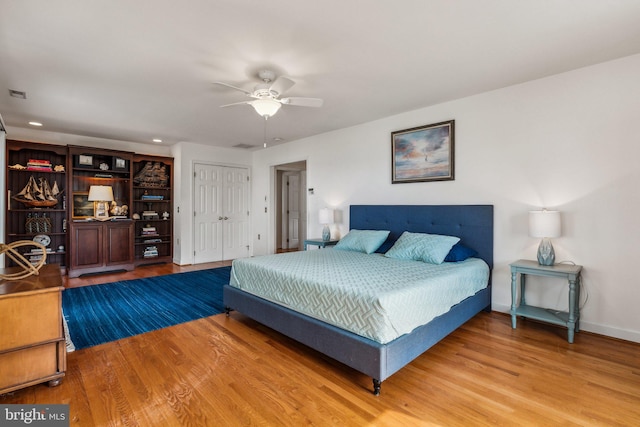 bedroom featuring ceiling fan and wood-type flooring