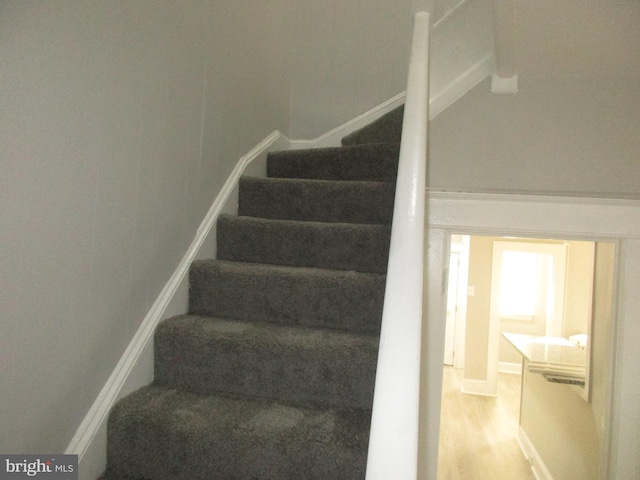 stairs with wood-type flooring