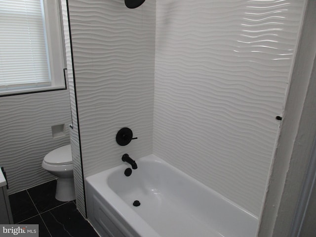 bathroom with tub / shower combination, tile patterned flooring, and toilet