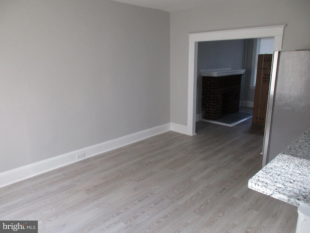 unfurnished room featuring light hardwood / wood-style flooring