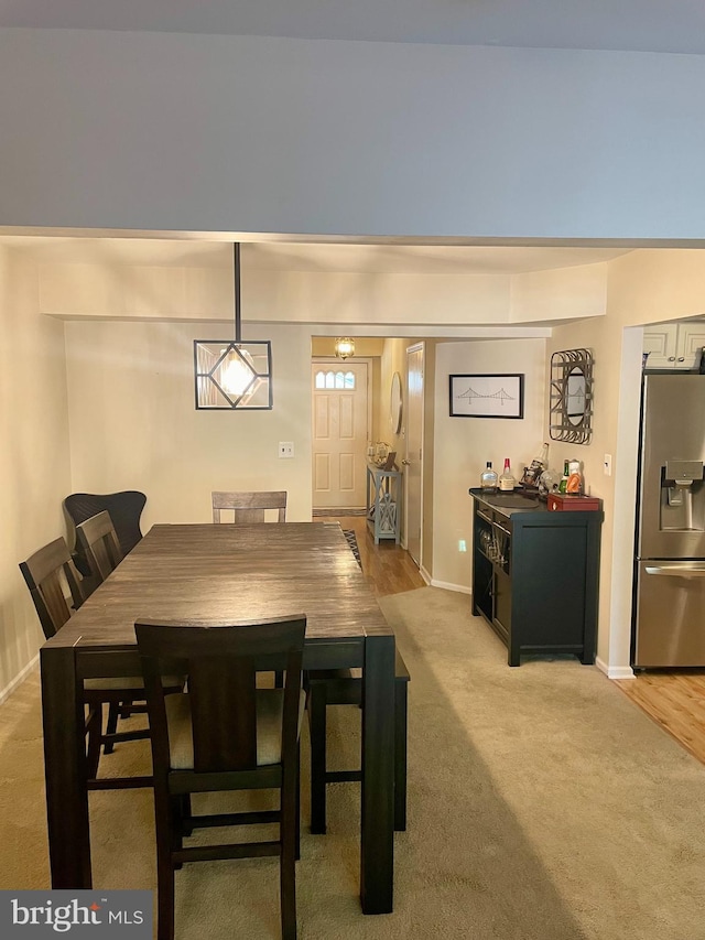 dining area with light hardwood / wood-style floors