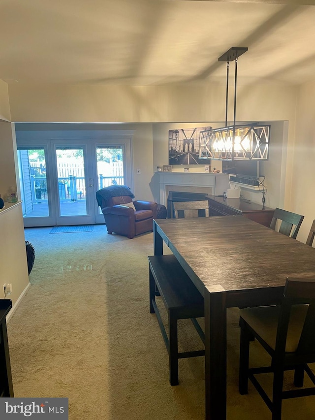 dining area featuring carpet