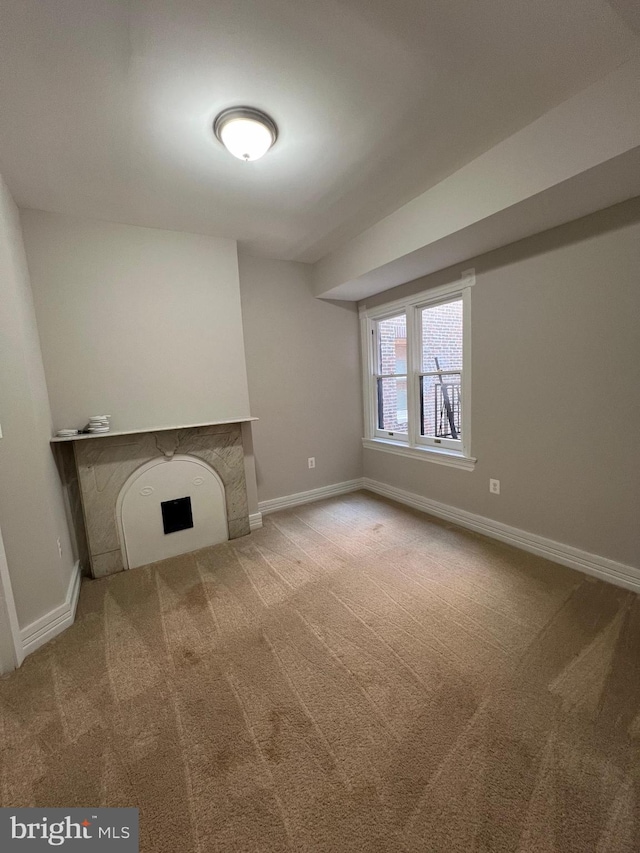 unfurnished living room with carpet floors