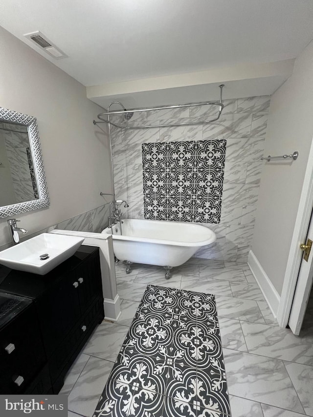 bathroom featuring shower with separate bathtub, vanity, and tile walls