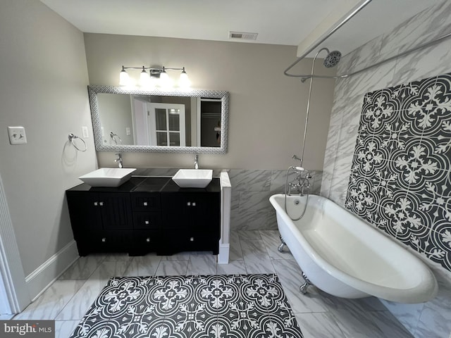 bathroom with tile walls and vanity