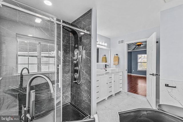 bathroom featuring vanity, a shower with shower door, and hardwood / wood-style floors