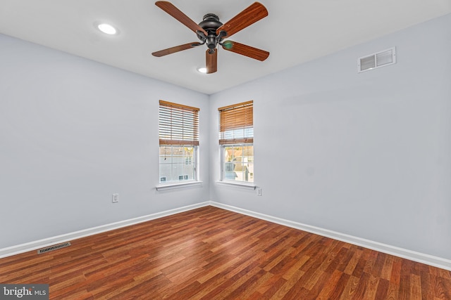 unfurnished room featuring ceiling fan and hardwood / wood-style flooring