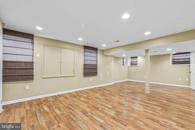 basement featuring light hardwood / wood-style floors