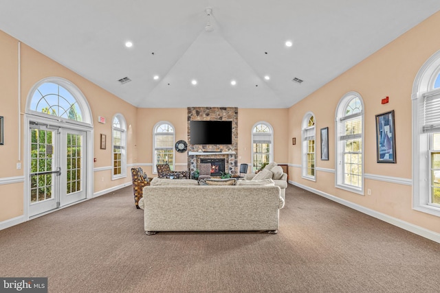 living room featuring light colored carpet and plenty of natural light