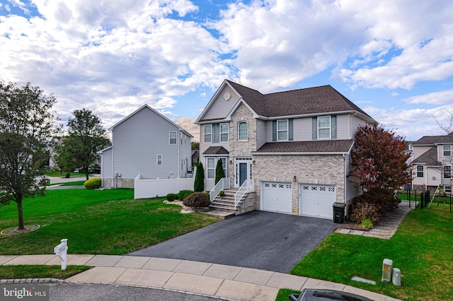 view of front property featuring a front lawn and a garage