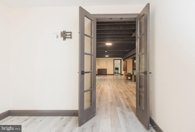 hall with light hardwood / wood-style floors