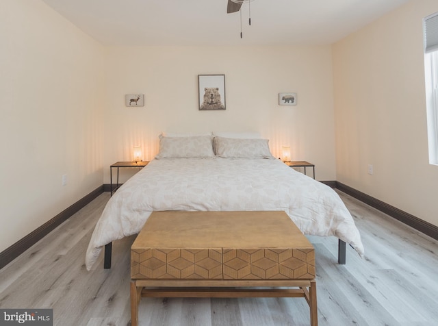 bedroom featuring light hardwood / wood-style flooring and ceiling fan