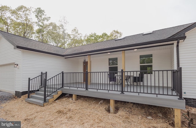 back of house with a garage