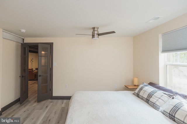 bedroom featuring light hardwood / wood-style floors and ceiling fan